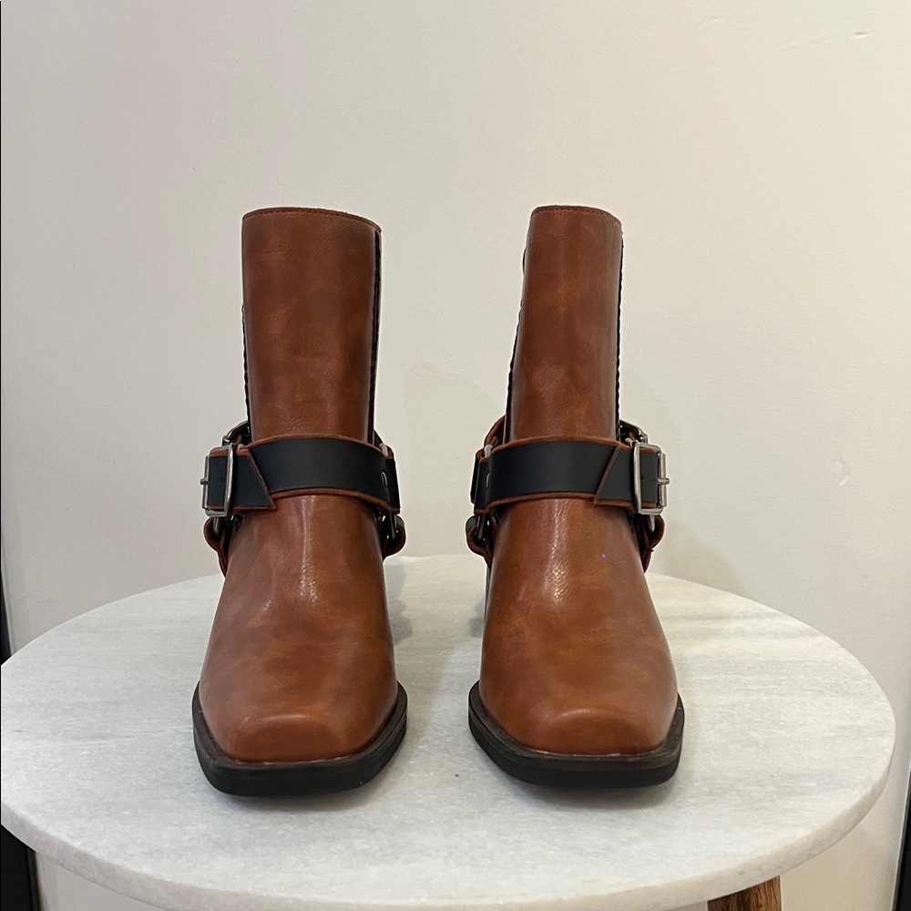 Moto boot with cool leather and hardware straps.